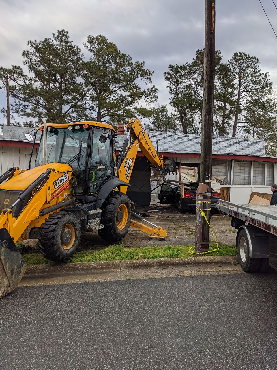 Officer Injured After Crashing Into Vehicle, Then Building